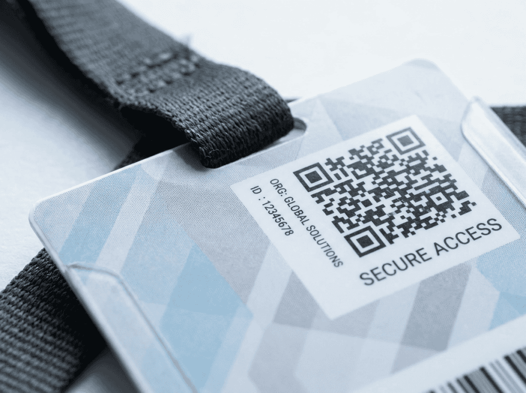 Close-up of a retransfer-printed ID badge showing QR code, microtext, and edge-to-edge print quality
